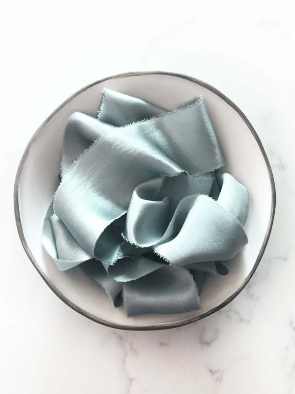 Handcrafted silk ribbon in Eucalyptus with frayed edges